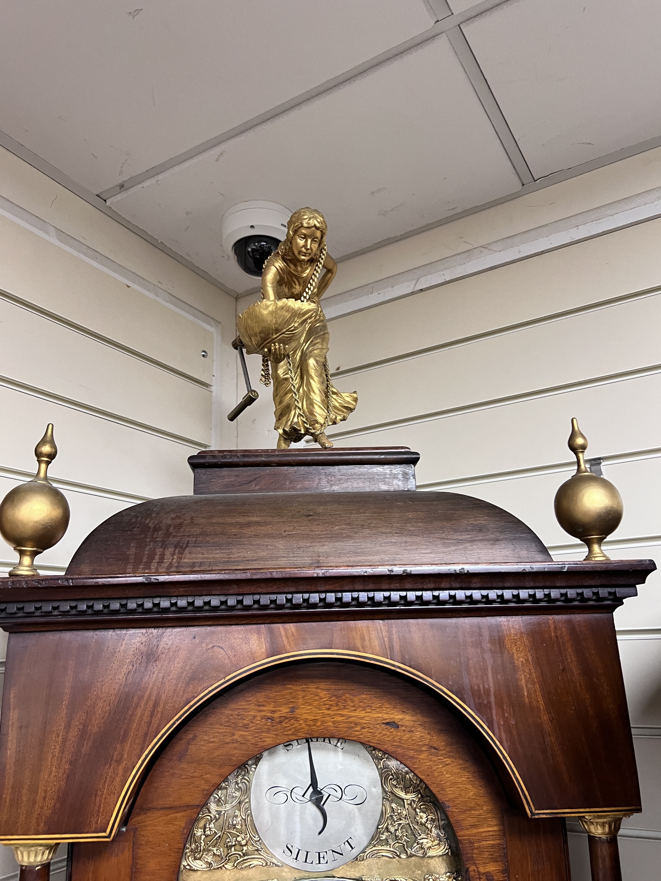 A George III and later inlaid mahogany eight day longcase clock, with gilt figural finial, J.Cowen, London, height 250cm